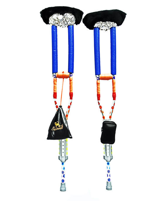 A picture of two crutches wrapped in brightly colored tape, decals, sequinned fabric, and sheepskin.