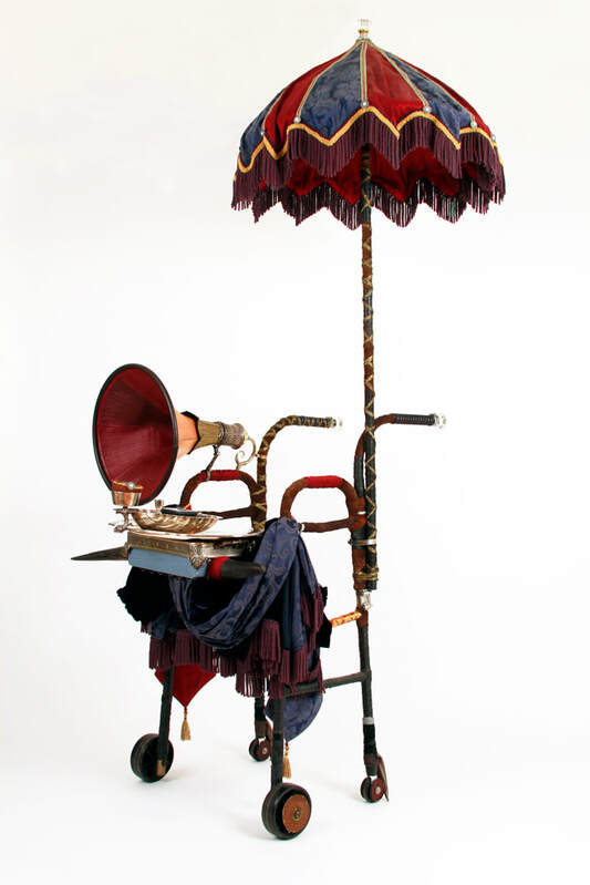 A walker dressed up as a mobile Victorian Bath house with attached parasol, cow horns, and gramophone.