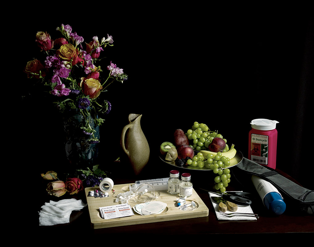 Still life of flowers, fruits, a jug, and a cutting board full of medications and medical equipment.