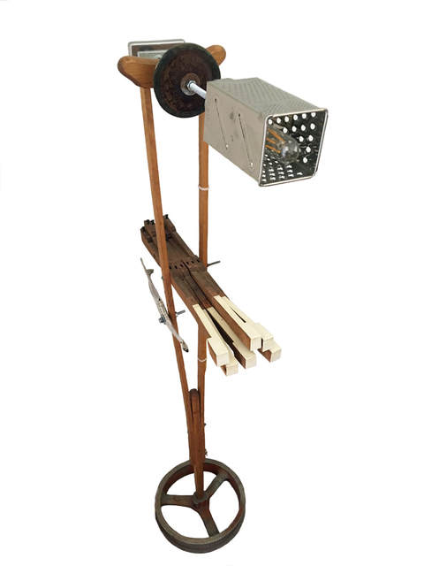 A lamp made from piano keys, a box grater, a crutch, and a jawbone.