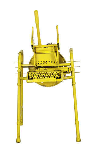 Front view of a bright yellow walker with attached typewriter and mop wringer.